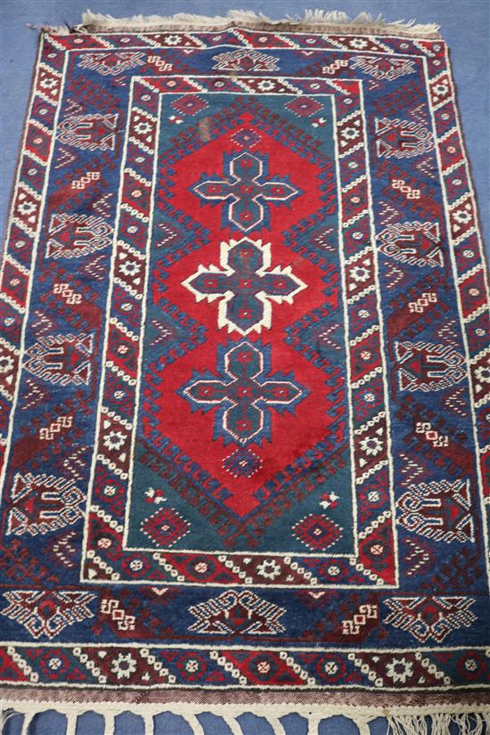 A Turkistan red ground rug, 6ft x 4ft 1in.
